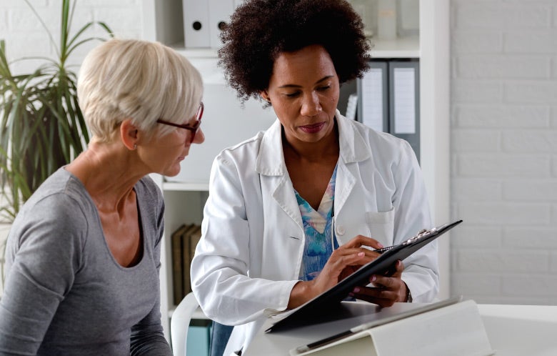 doctor talking to patient clipboard blog image template    