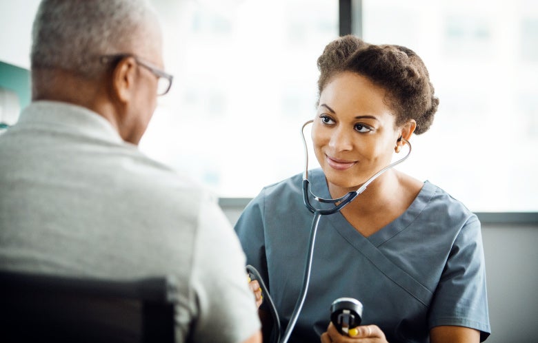 nurse reading blood pressure senior patient blog image template    